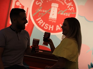 Visitors checking the temperature of roasted barley at Smithwicks Experience Tour in Kilkenny