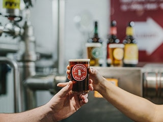 Visitors tasting Smithiwicks beer is done at Smithwicks Experience Tour in Kilkenny